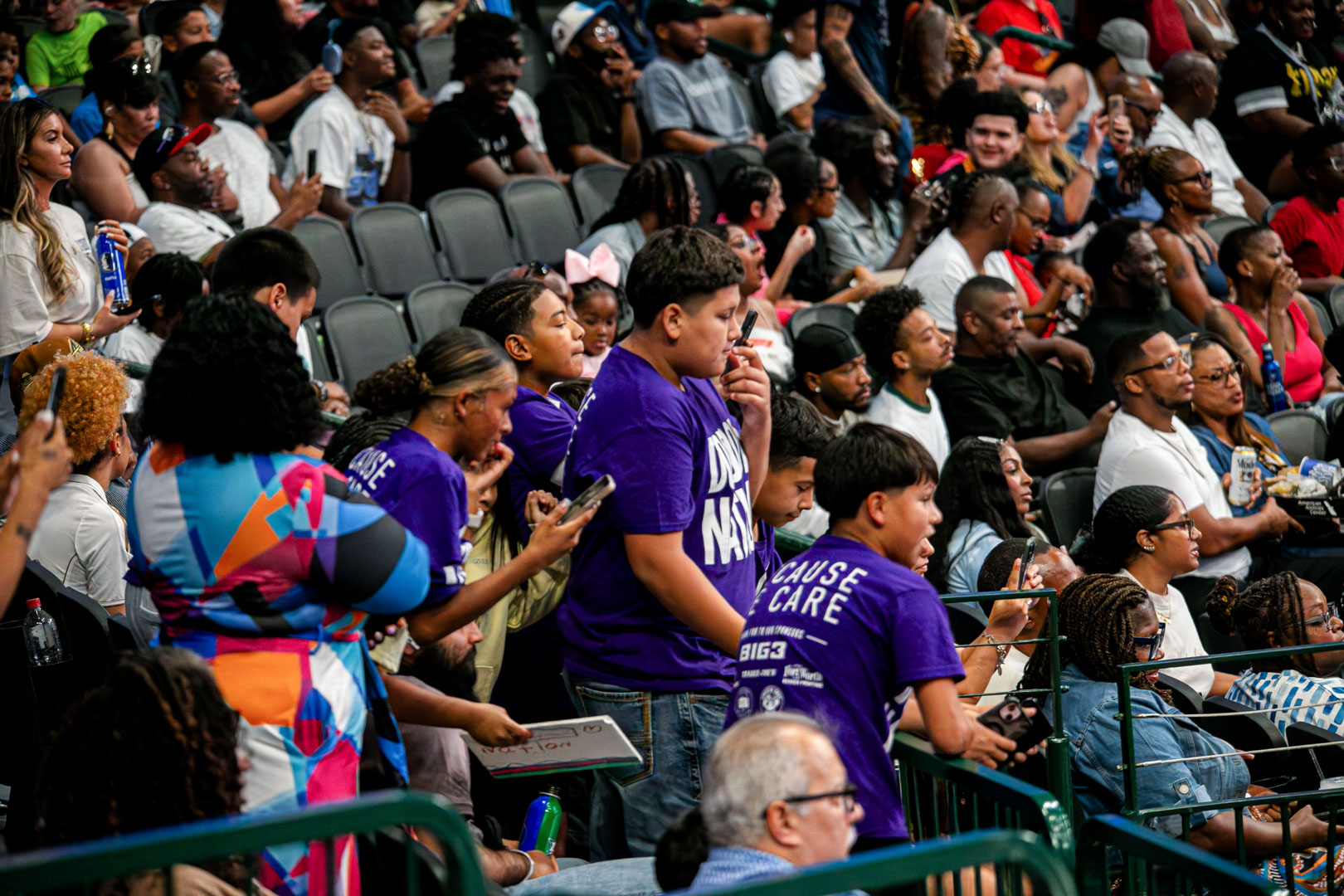 The group standing together in The Impact Section during the game