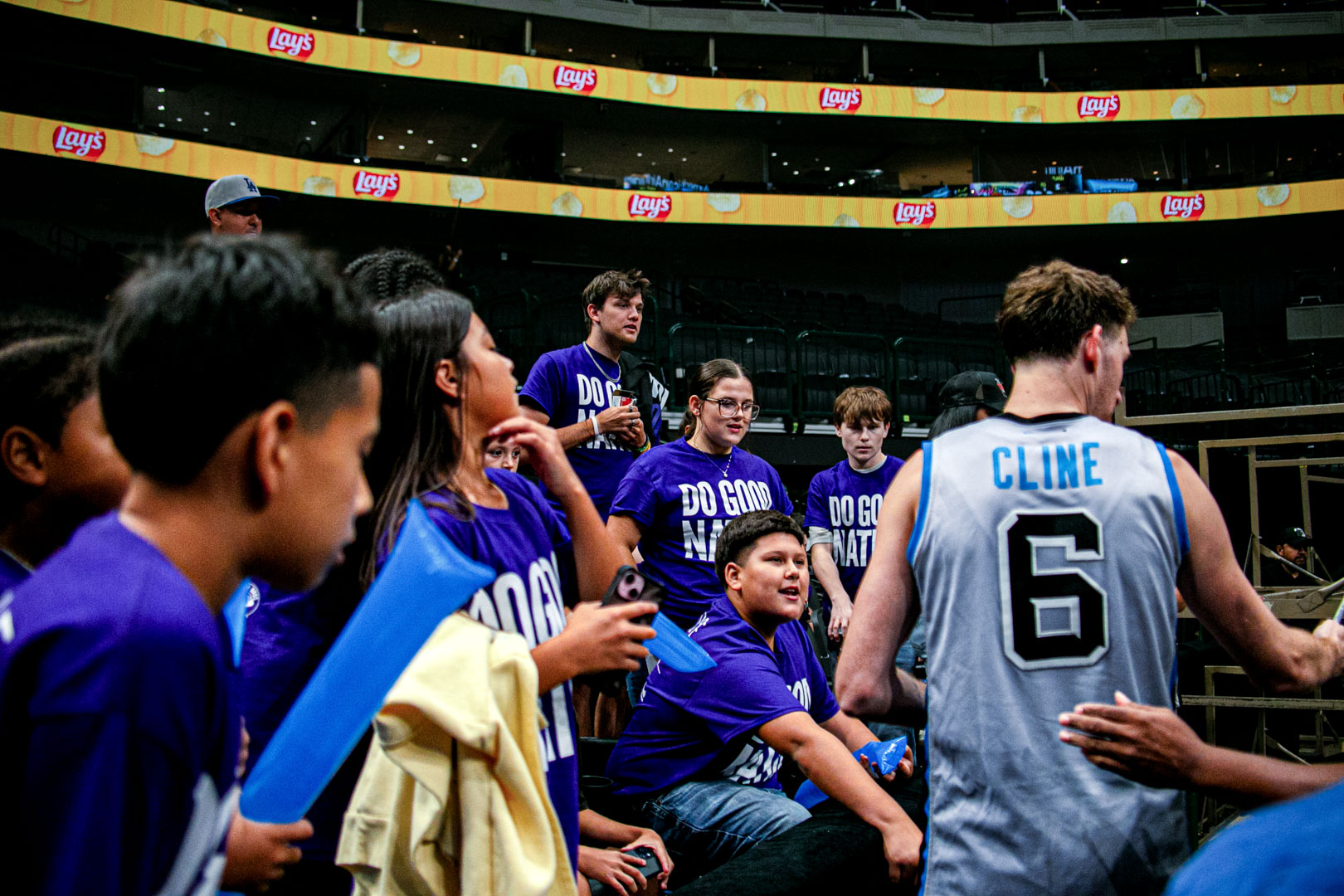 Kids meeting a BIG3 player in a number 6 Cline jersey courtside after the final buzzer