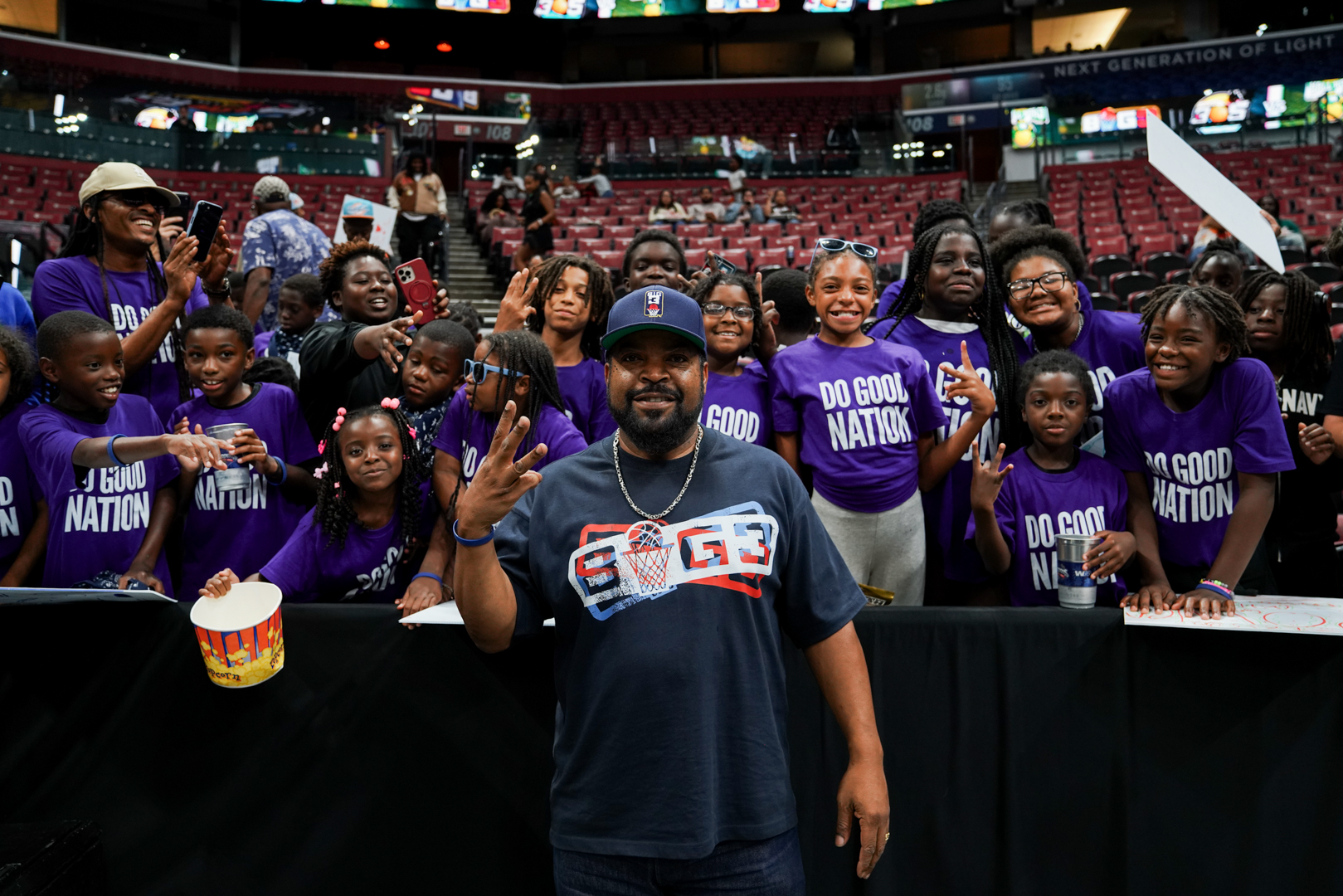 Youth cheering together at a professional sports game