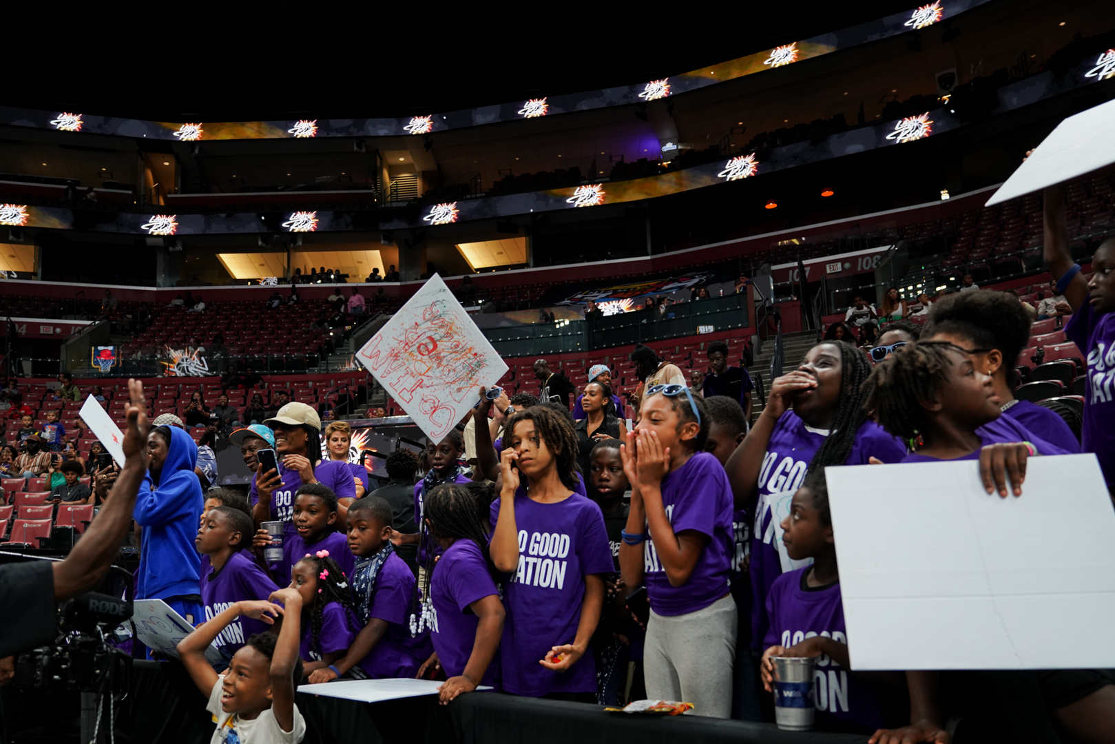 The Impact Section at Amerant Bank Arena, full of youth holding the signs they made