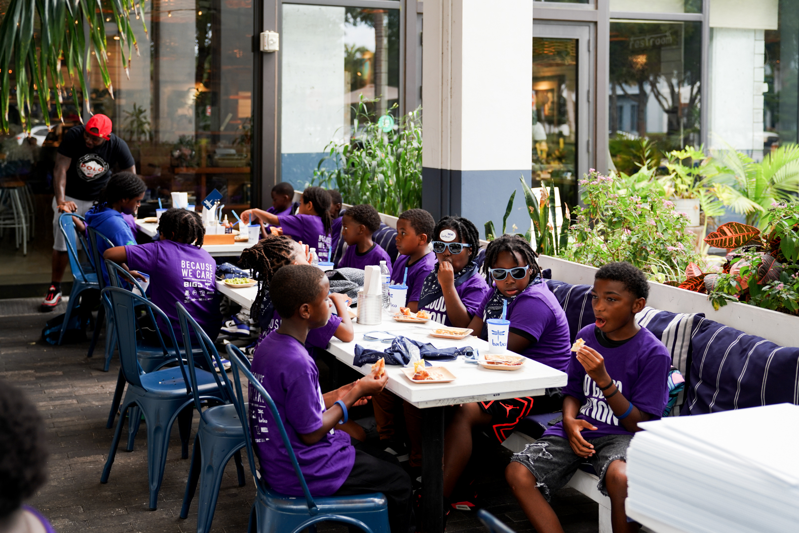 The group sharing the pregame meal together on the bartaco patio